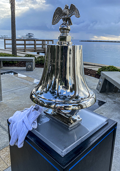 Silver memorial bell rung during the fallen officers service